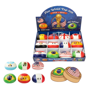 A display box labeled Patterned Steamed Bun Dough Shaping Squishy contains squishy toys shaped like steamed buns, each with unique patterns and cartoon faces. Additional squishies are displayed in front of the box.